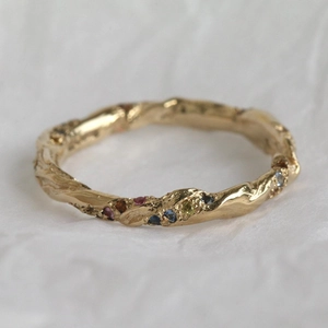 Vintage 18K gold plated spiral ring with colorful zircon gemstones on white background