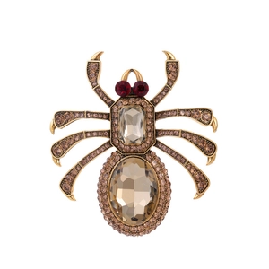 Golden spider brooch featuring champagne crystals and red gemstone eyes for women