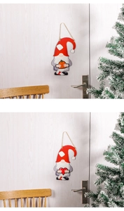 Interchangeable wooden Christmas gnomes with pumpkin and heart on a white holiday door