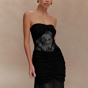 Detailed close-up of the black lace patchwork and elegant ruched design on the tube long dress
