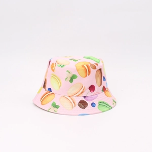 Pink reversible bucket hat for children with colorful macaron and sweet dessert prints