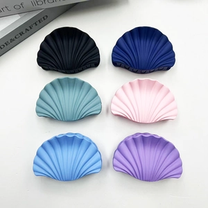Detailed set of six marble texture shell-shaped hair clips in various pastel matte colors