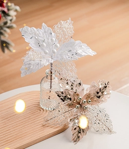 Lace Christmas flower with sequins and pearls in a vase on a wooden tray for decor