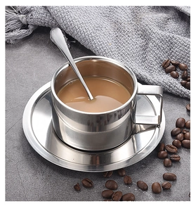 Polished double-layer stainless steel coffee cup set with saucer and spoon on marble
