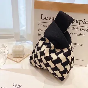 Minimalist knit tote bag with black and white geometric patterns for daily leisure use
