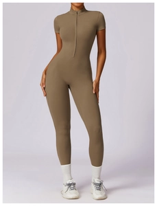 Close-up of khaki short sleeve yoga bodysuit with zipper collar and seamless fit