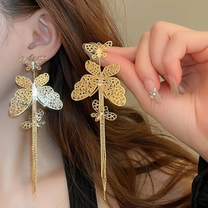 Exquisite gold-plated hollow butterfly tassel drop earrings for women with elegant design