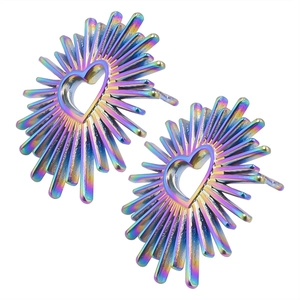 Detail of heart-shaped sunburst earrings with a vibrant rainbow iridescent finish