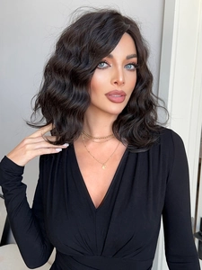 Detailed texture of wavy synthetic brown hair on a medium-length curly wig style