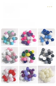 Macro detail of nine various colorful woven cotton ball LED fairy string lights styles
