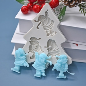 Christmas tree silicone mold set for DIY baking with three Santa Claus figurines
