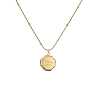Golden titanium steel necklace with octagonal Forever Love pendant on white background