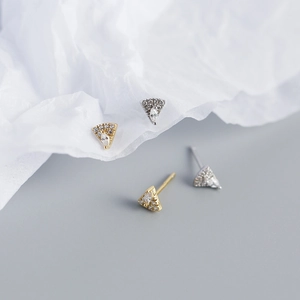 Detail view of geometric fan-shaped S925 silver stud earrings in gold and silver finish