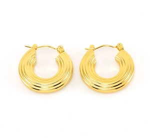 Detailed macro view of 18K gold stainless steel hoop earrings with spiral step texture