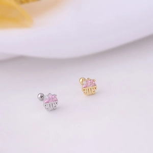 Macro detail of jellyfish cartilage studs with pink zircon and screw back closure