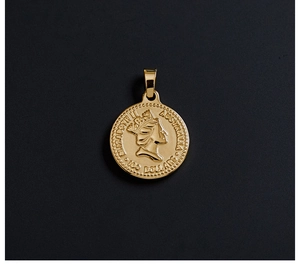 Detail view of 18K gold plated Elizabeth II coin pendant with relief engraving