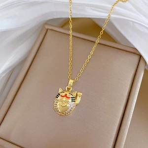 Elegant gold titanium steel necklace featuring a lucky cat pendant with sparkling zircons