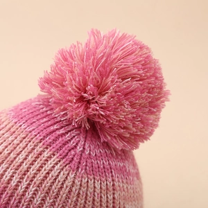 Kids gradient pink knitted hat with fluffy pompom detail for warm winter comfort