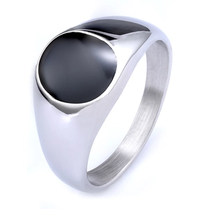 Detail of silver stainless steel signet ring with a polished black oval inlay face