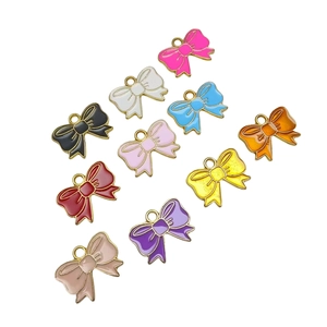 Set of 10 colorful enamel bow charms in various vibrant colors for DIY jewelry making