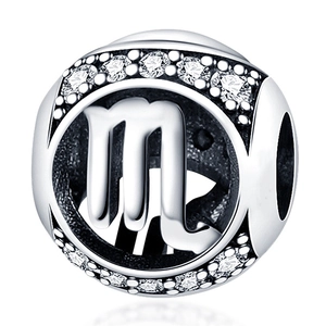 Detailed macro view of silver Scorpio zodiac charm with sparkling cubic zirconia stones