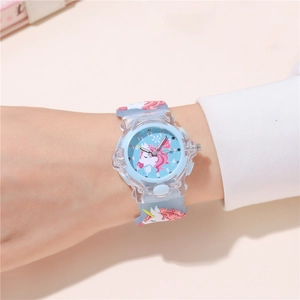 Close-up of light blue unicorn kids watch with silicone strap worn on a child's wrist