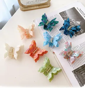 Close-up of assorted colorful acetate butterfly hair claws with marbled textures