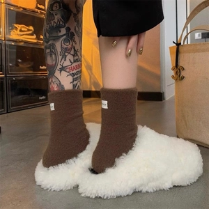 Winter fluffy white slippers and brown crew socks set with minimalist fabric label