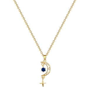 Elegant gold celestial necklace featuring a diamond-set moon pendant and blue gemstone