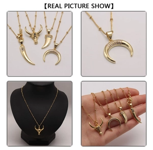 Detailed views of gold horn and crescent moon necklaces with inlaid zircon stones