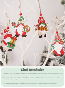 Set of four Nordic style wooden Christmas gnomes with knit patterns hanging on branches