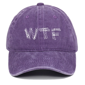 Close-up of vintage purple washed cotton baseball cap with white WTF letter embroidery