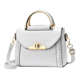 Elegant white leather crossbody bag with gold twist lock and woven side details
