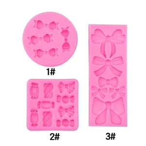 Three pink silicone bow and candy molds for fondant cake decoration and DIY crafts