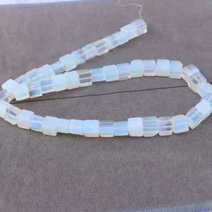 Close-up of square opal stone beads with milky white finish for DIY jewelry making