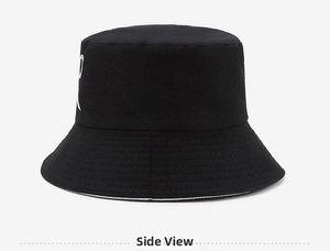 Side view detail of black bucket hat featuring white letter embroidery and dual-sided brim