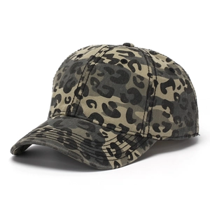 Detailed view of the leopard and camo print canvas baseball cap with reinforced stitching