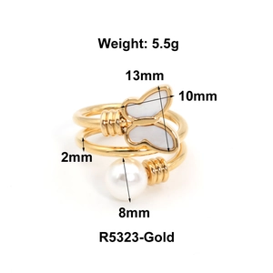 Detailed view of adjustable gold butterfly ring with pearl and dimension specifications