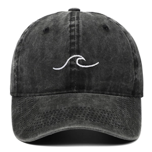Close-up of wave embroidery on vintage washed cotton grey baseball cap fabric