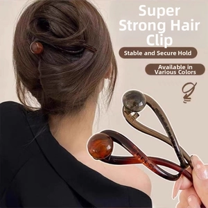 Detailed view of twist ball hair clip in dark coffee and amber colors with high grip