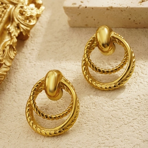 Vintage gold triple-hoop earrings featuring twisted rope texture on ivory stone base