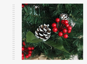 Detailed close-up of Christmas berries, pine cones, and snowy pine needles decoration