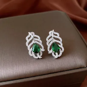 Exquisite silver feather earrings with pear-cut emerald zircon and micro-pave crystals