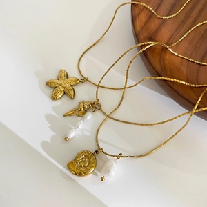 Gold ocean necklaces with starfish conch pendants and freshwater pearls for women