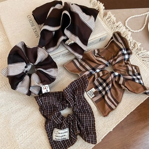 Detail of Korean style striped and checkered scrunchie set with Dreamer label