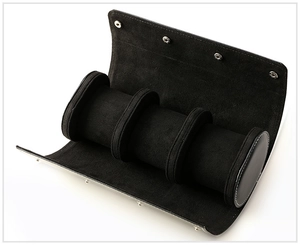 Detail of black leather watch roll with three slots and premium soft suede interior lining