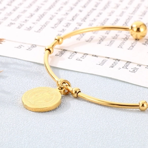 Minimalist 18K gold-plated stainless steel bangle featuring a St. Benedict coin pendant