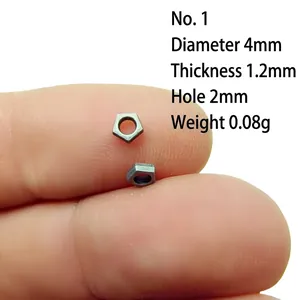 Macro shot of 4mm antique silver bead spacer showing detailed size measurements on fingertips