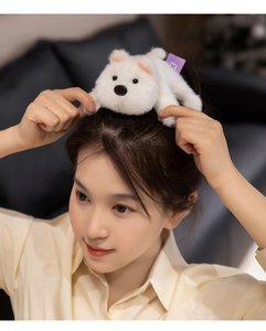 Cute white plush puppy hair clip shown on model featuring soft faux fur and bead eyes