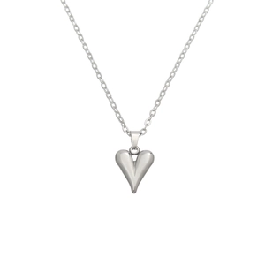 Macro detail of silver heart pendant on a delicate O-chain necklace in stainless steel
